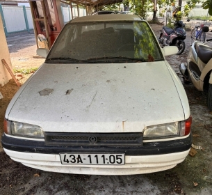 TS10: 01 (một) xe ô tô đã qua sử dụng nhãn hiệu MAZDA; số loại: 323, biển kiểm soát số: 43A-111.05; số chỗ ngồi: 05 chỗ; màu sơn: Trắng; năm/nước sản xuất: 1995/Việt Nam; số khung: BG1062-MH001578; số máy: B6-510774 Lần 3